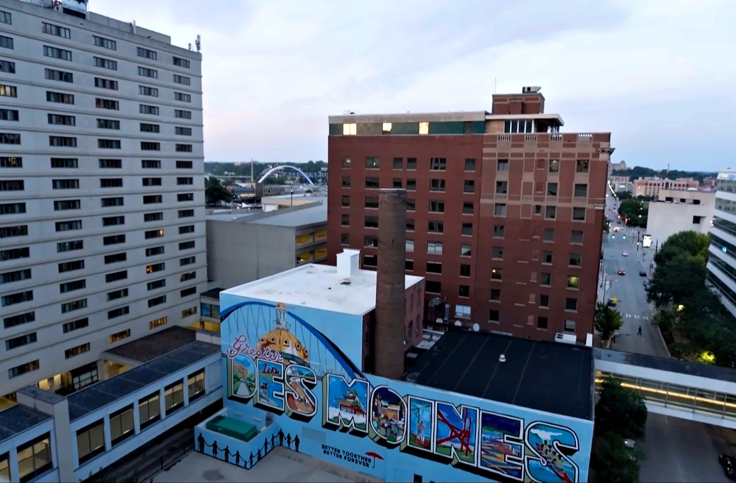 A Greetings from Des Moines mural painted on a building downtown